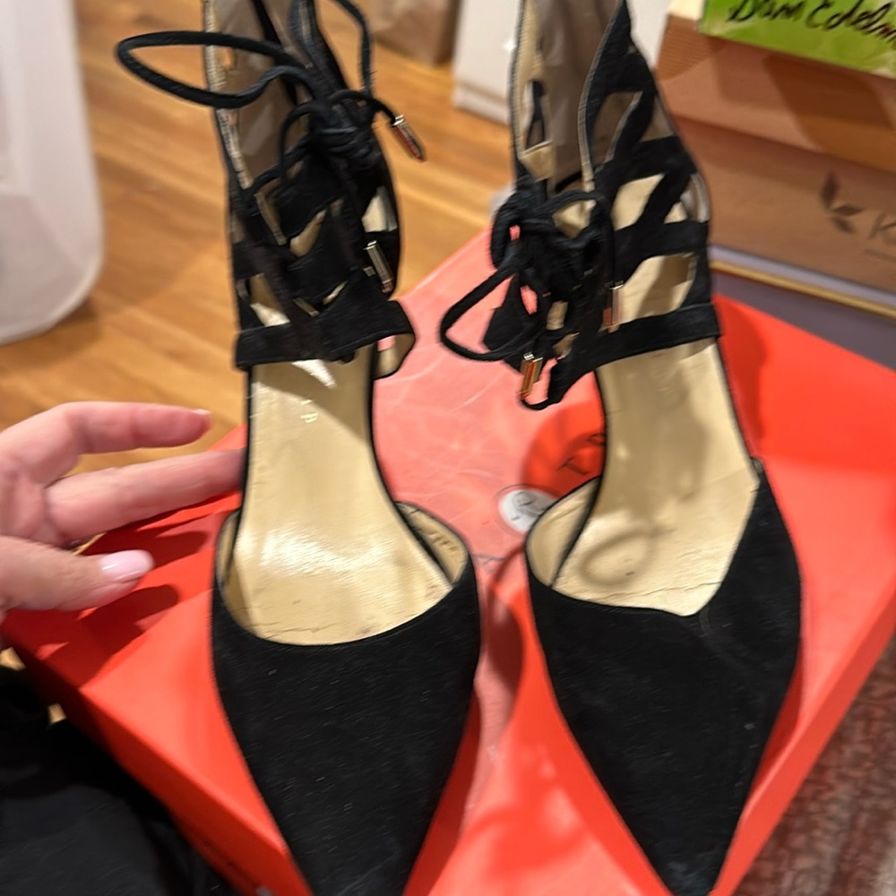 Black suede pumps with toe and cut outs.  Zipper back.